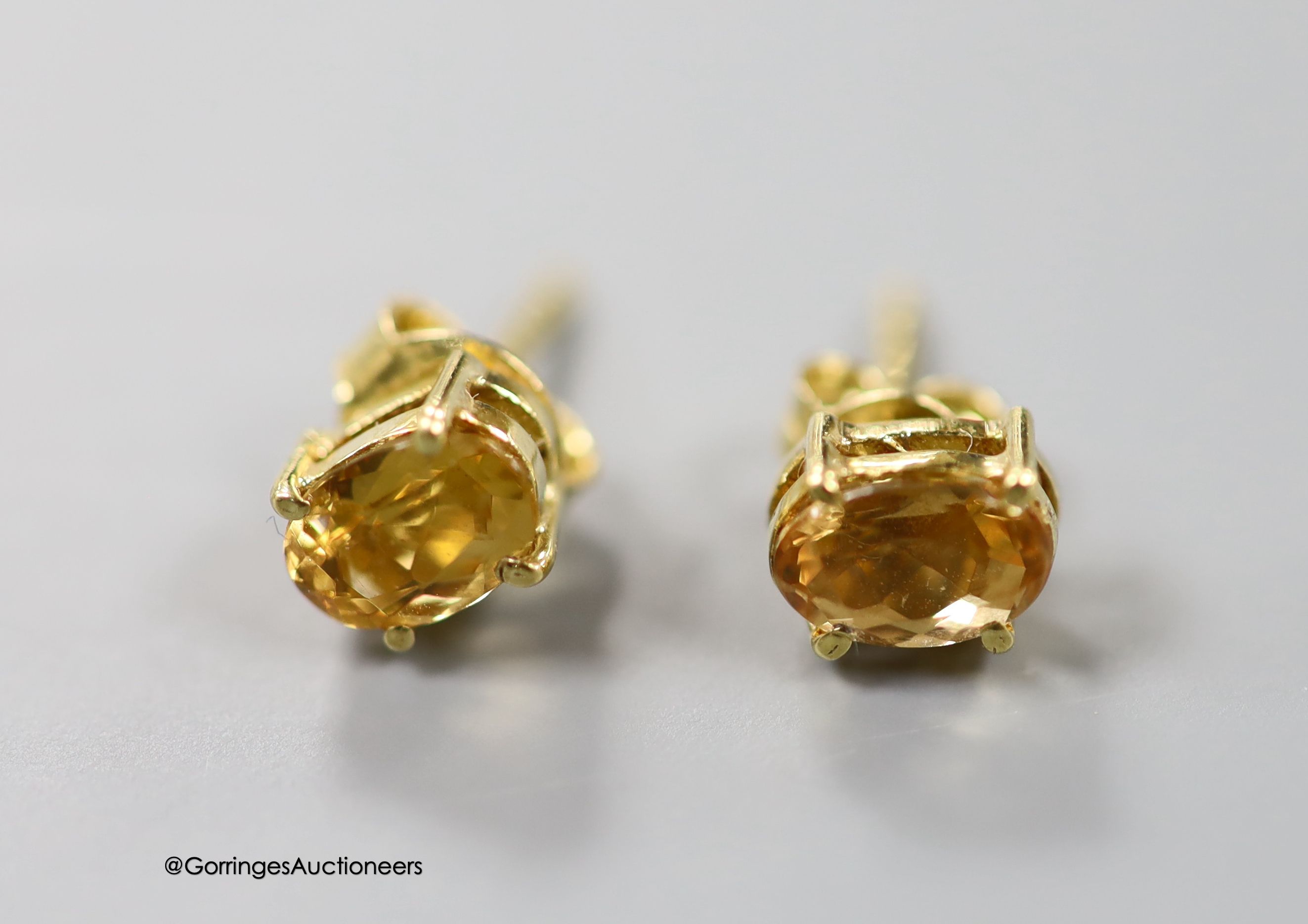 A pair of 9ct, sapphire and diamond set oval earrings (no butterflies), a pair of yellow metal and diamond set earrings(adapted), one other pair, a modern 9ct mounted oval cameo shell brooch and a 9ct gold and CZ ring